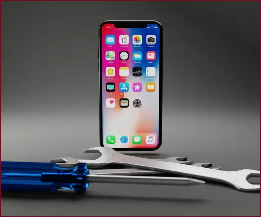 Werkzeuge-vor-stehendem-Smartphone-mit-Icons-symbolisiert-Installation-und-Wartung